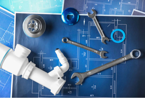 Concept of Port St. Lucie commercial plumbing, plumber tools on blueprint