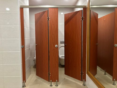 This image is of a few public restroom stalls, concept of Deerfield Beach commercial plumbing