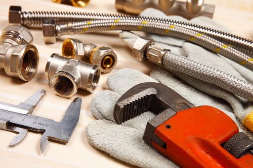Image is of plumbing tools and supplies concept of Palm Beach plumbing services
