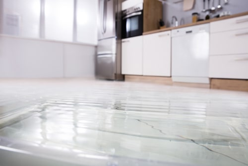 Kitchen flooded from water leak, concept of Miramar emergency plumbing services