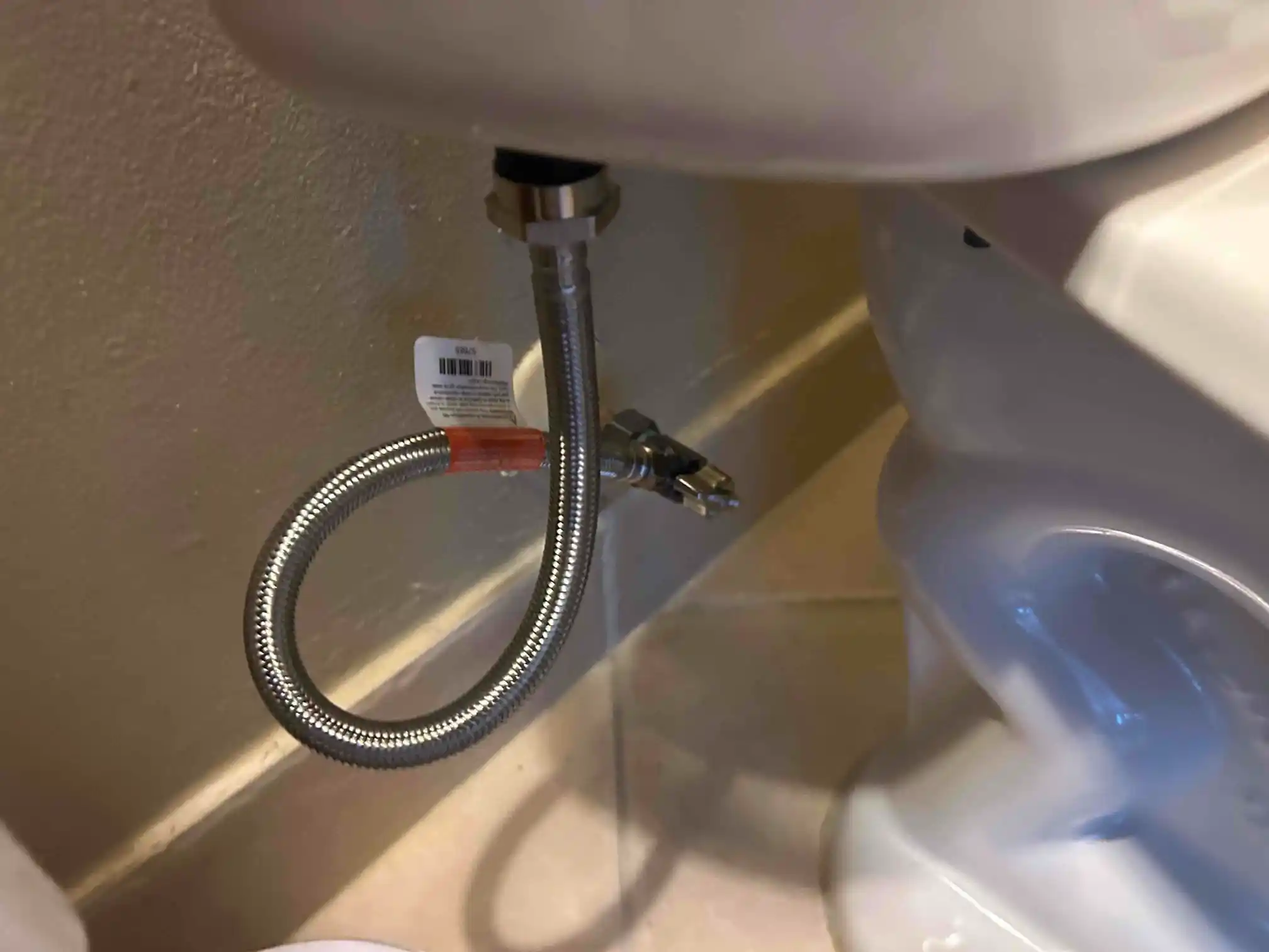 Toilet supply valve after leak repair